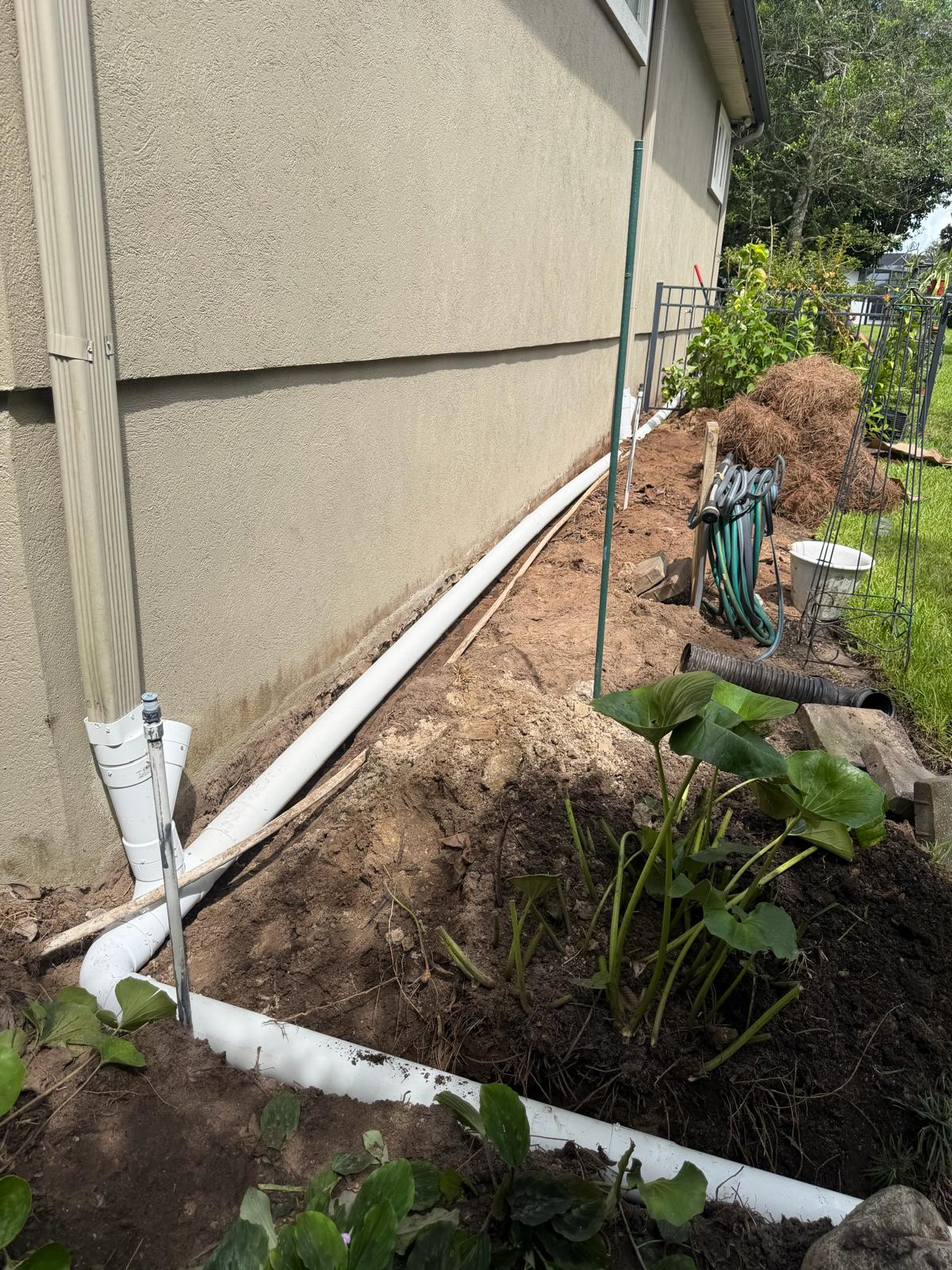 Underground drainage pipes for downspouts in Jackson County Florida